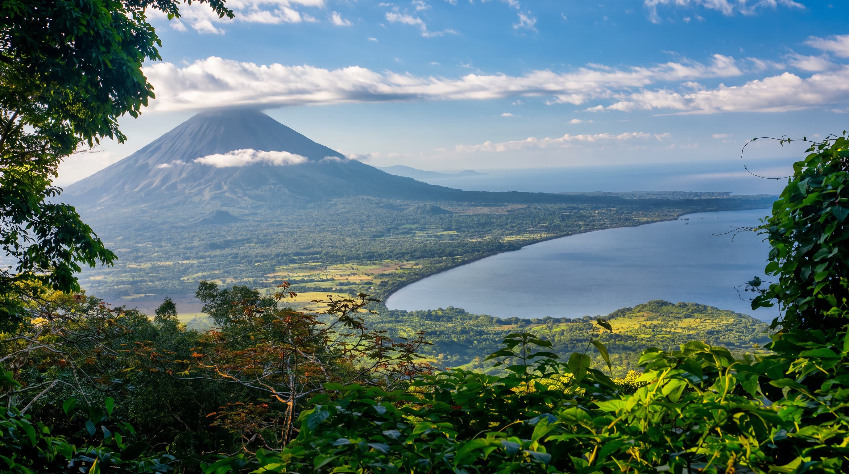 Concepción Volcano and Lake Nicaragua on Ometepe Island, framed by tropical greenery